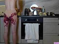 Mature milf with a tattoo on her ass seductively cooks dinner